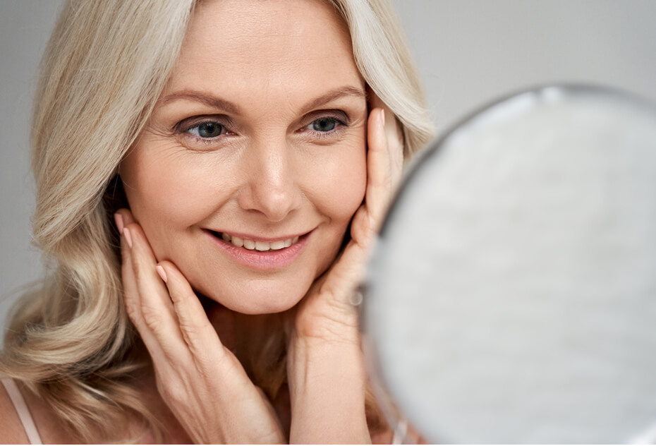 woman looking in the mirror